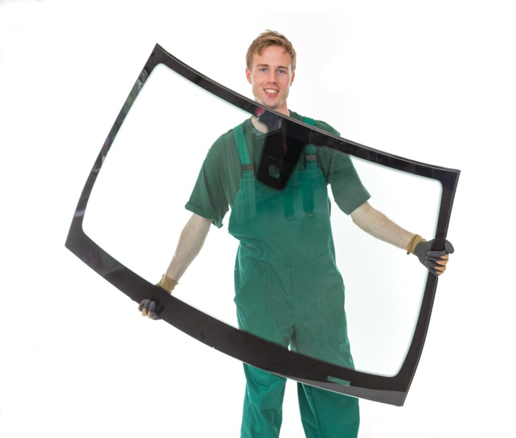 man carrying a windshield